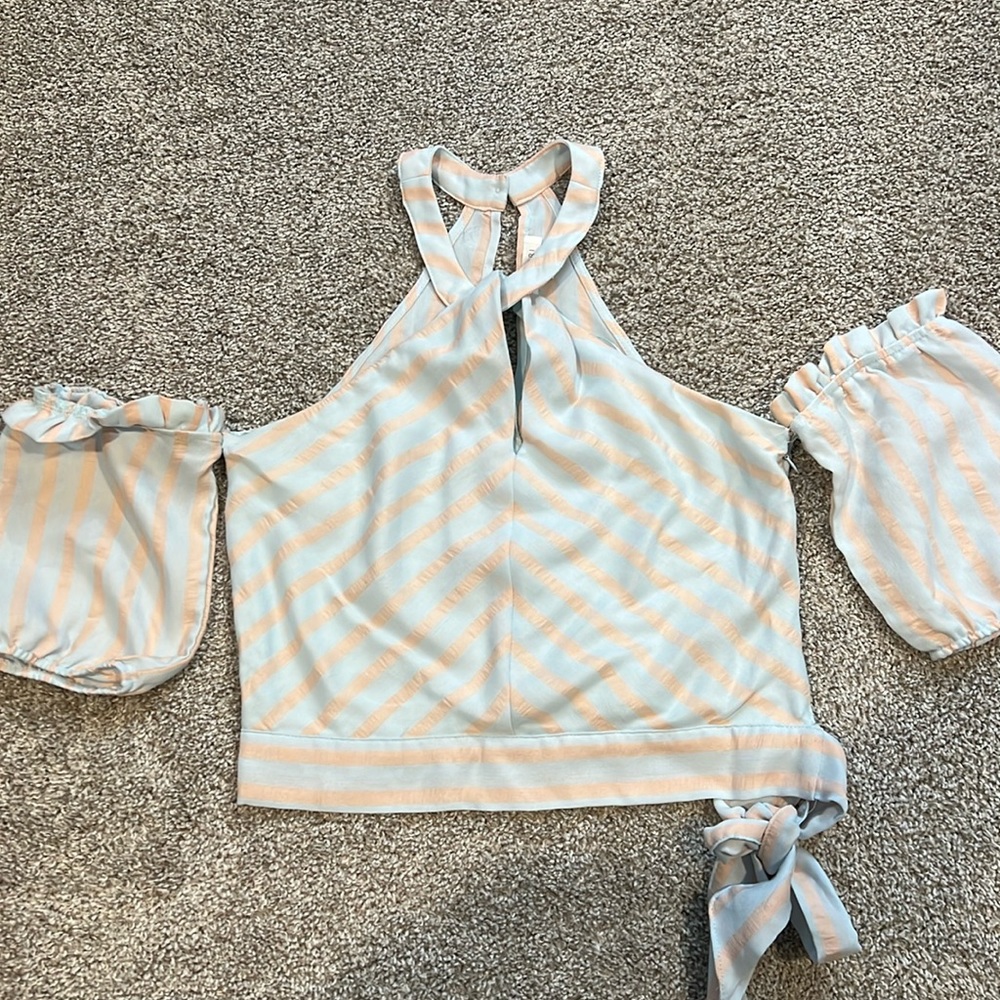 Adorable light blue and pink blouse.